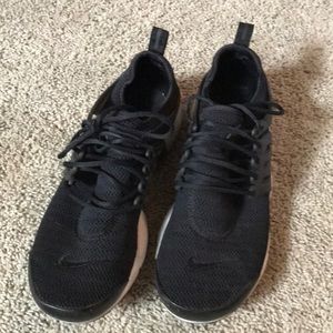 Nike Air Presto black athletic shoes